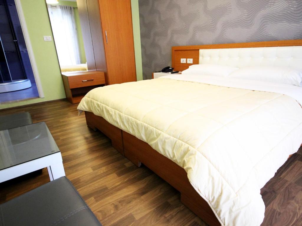 Postel nebo postele na pokoji v ubytování Hotel Bylis