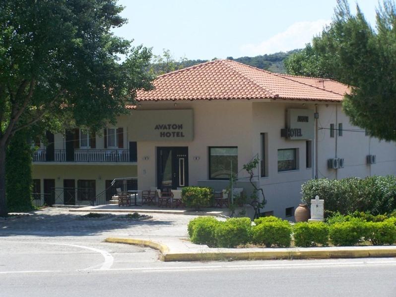 a hotel with a building with a sign that reads student hotel at Avaton Hotel in Ligourio