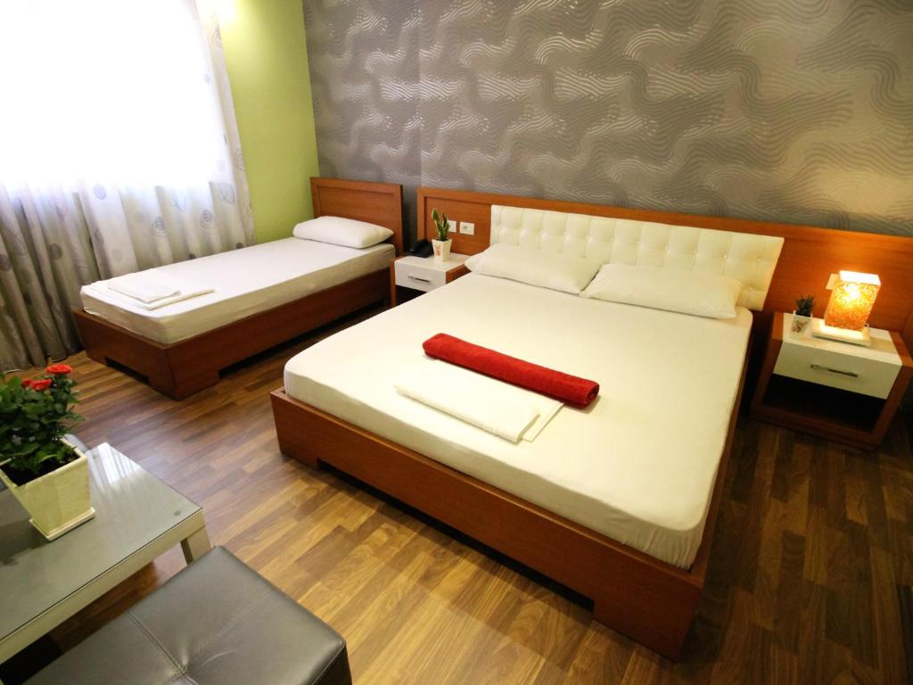 Postel nebo postele na pokoji v ubytování Hotel Bylis