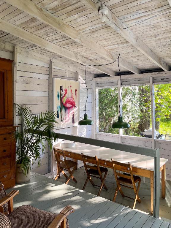 a dining room with a large wooden table and chairs at Chez Léo par Maison Dudley in Lac-Mégantic
