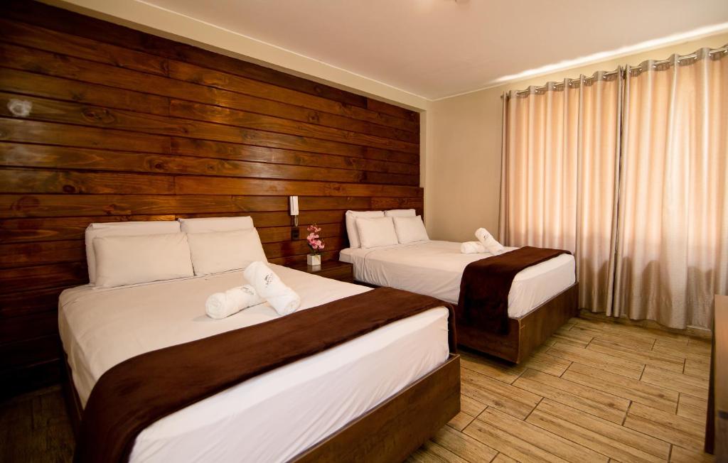 Postel nebo postele na pokoji v ubytování Hotel Campo & Leña
