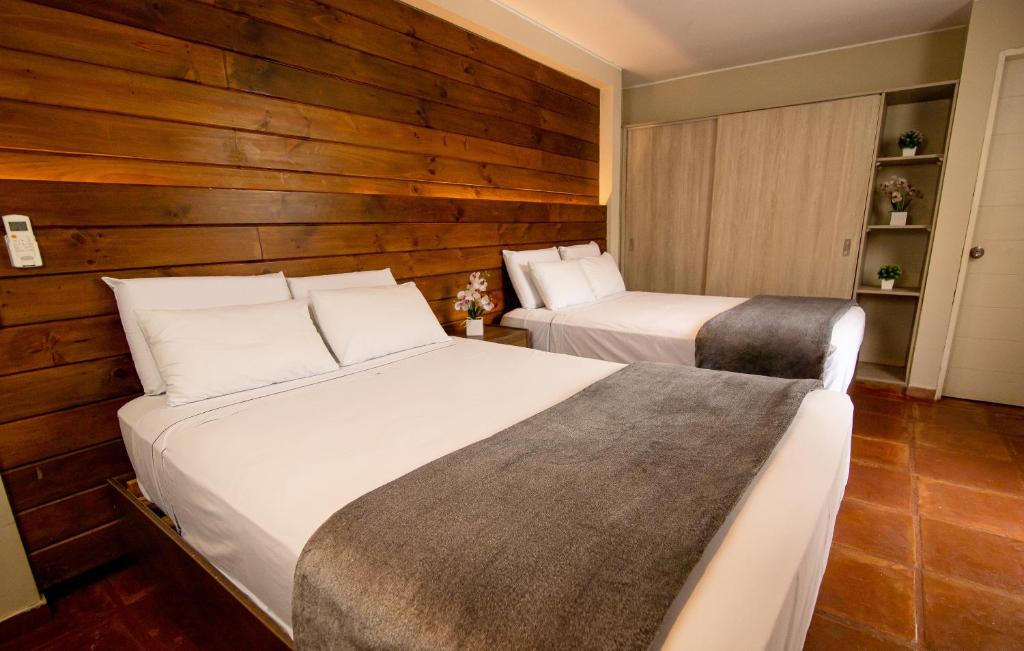 Postel nebo postele na pokoji v ubytování Hotel Campo & Leña