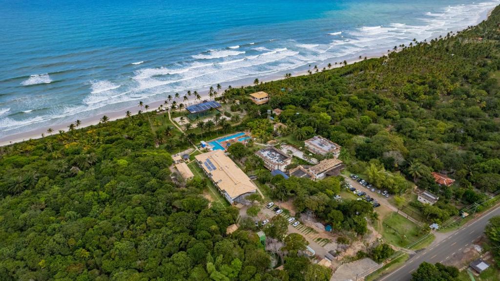 an aerial view of a resort and the beach at Ilheus North Hotel in Ilhéus
