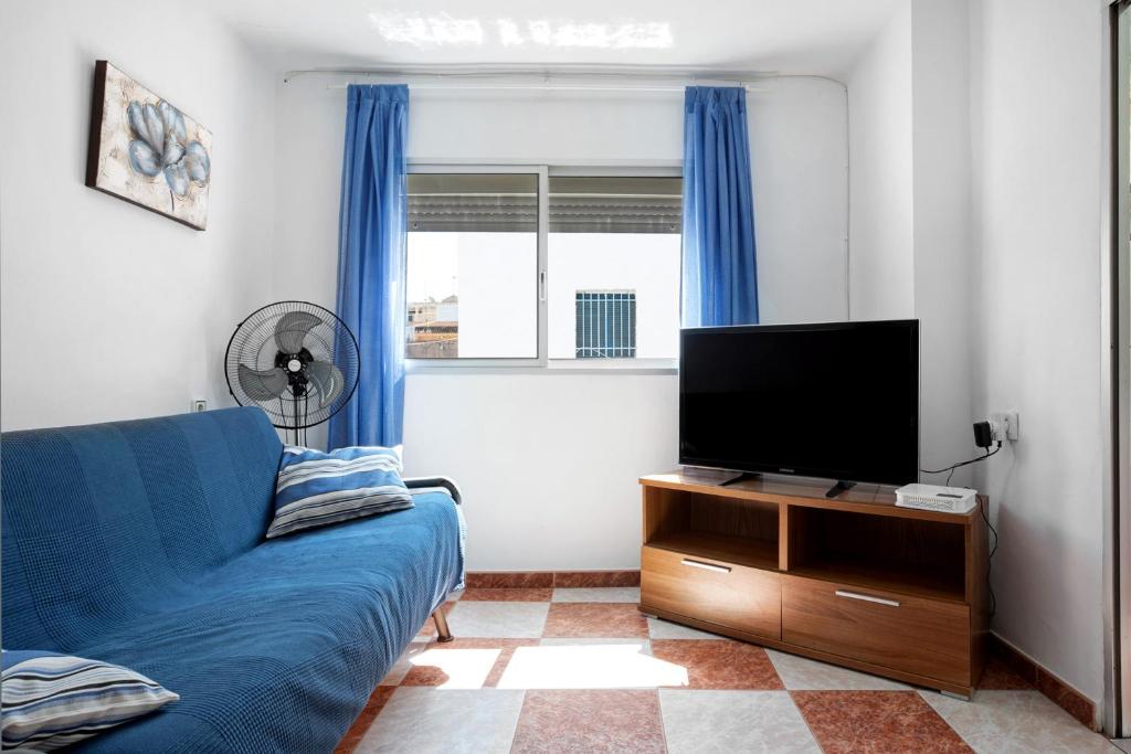 TV a/nebo společenská místnost v ubytování Casa Colomera 1