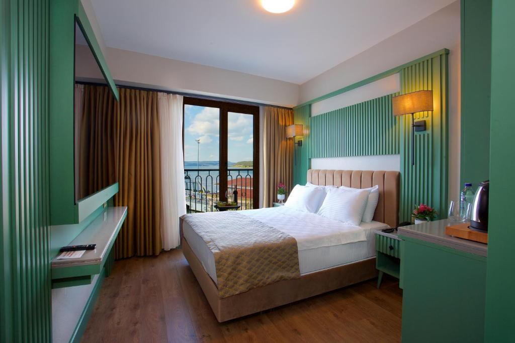 Postel nebo postele na pokoji v ubytování Çanakkale Bosphorus Port Aspen Hotel