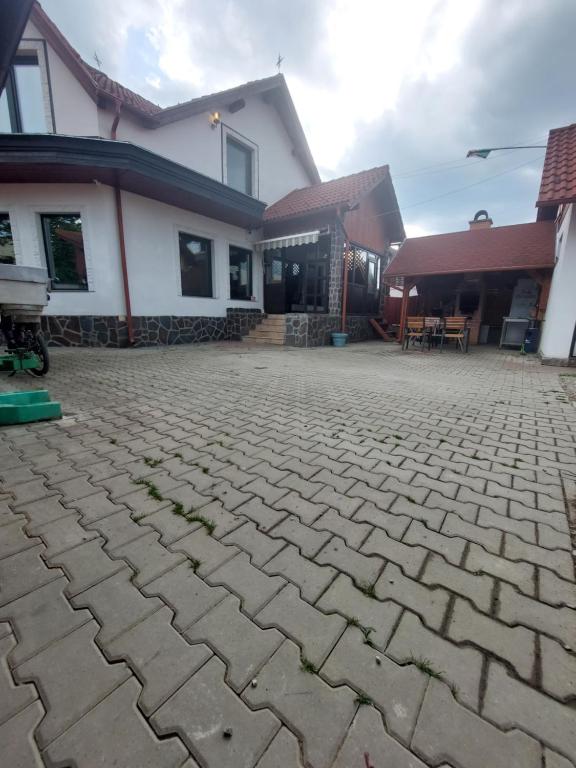 a stone driveway in front of a house at Morrison Rezidence in Miercurea-Ciuc