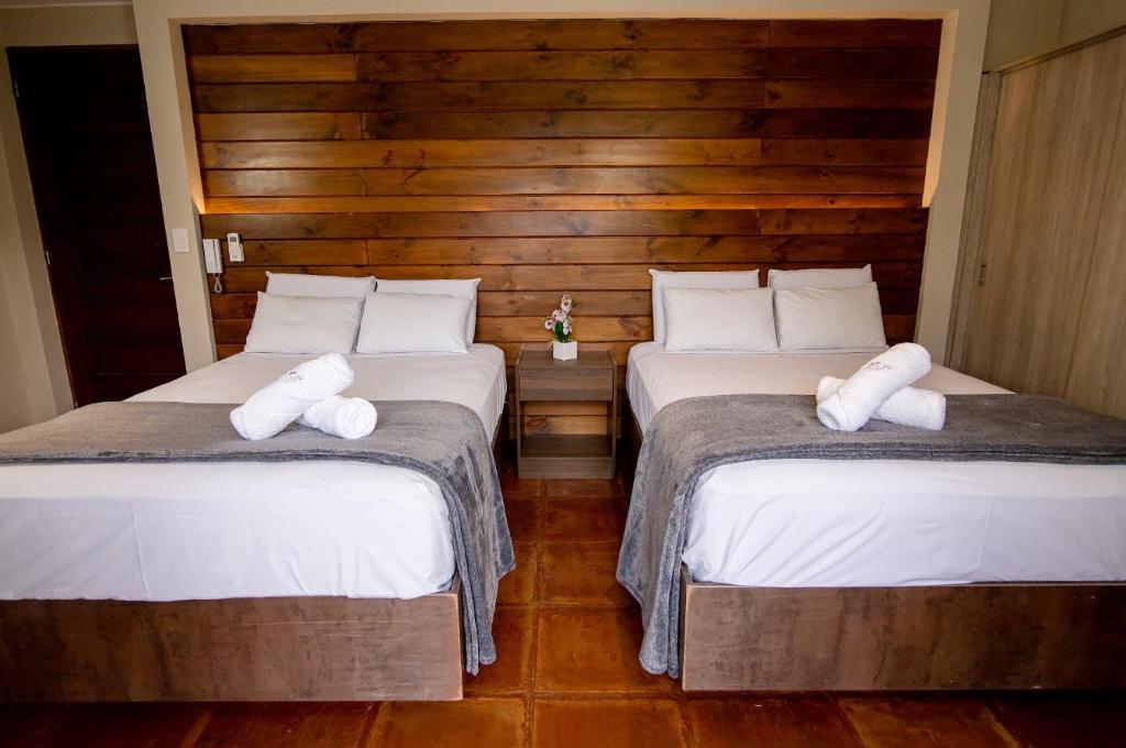 Postel nebo postele na pokoji v ubytování Hotel Campo & Leña