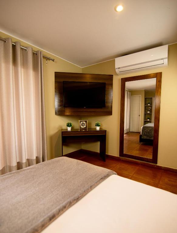 Postel nebo postele na pokoji v ubytování Hotel Campo & Leña