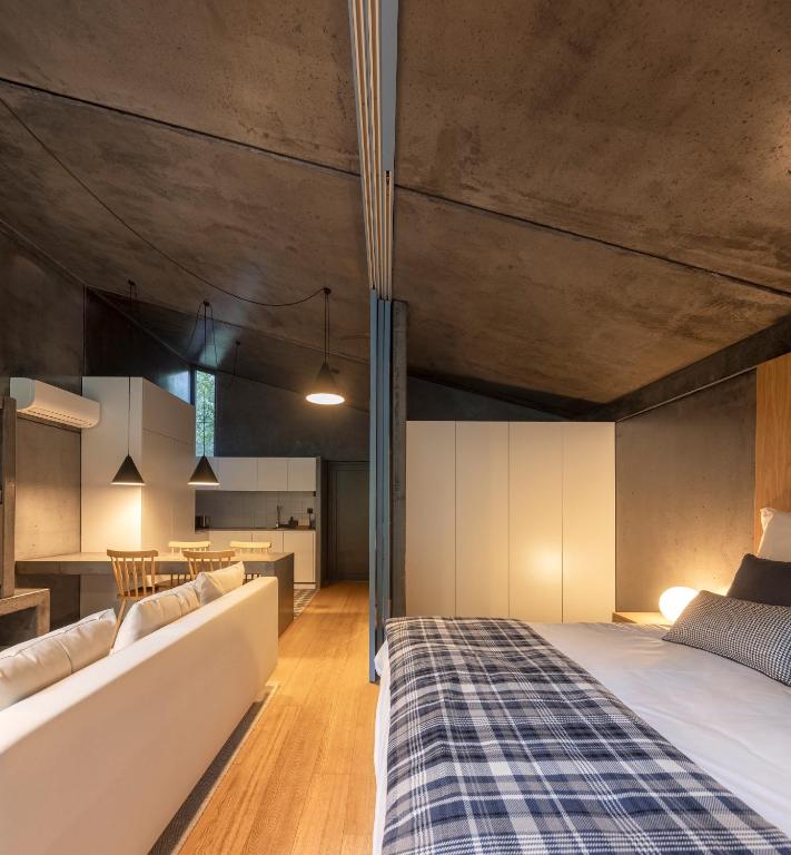 Uma cama ou camas num quarto em Syntony Hotels - Paradinha Village