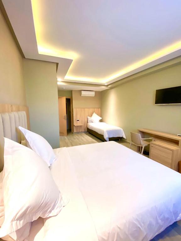 Postel nebo postele na pokoji v ubytování HOTEL CAFE PALAIS SALAM , Beni Mellal