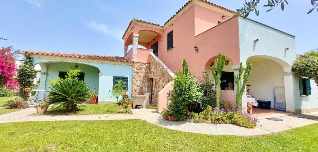 a house with a garden in the yard at ISS Travel, La Padula - apartments with private veranda and parking in San Teodoro