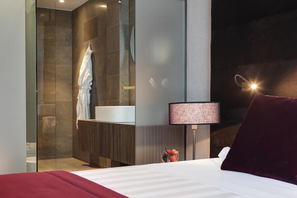 Postel nebo postele na pokoji v ubytování Grand Hotel Campione