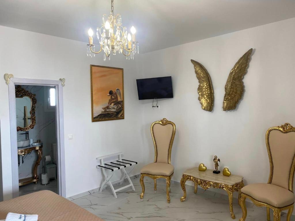 Televízia a/alebo spoločenská miestnosť v ubytovaní Mykonos Secret Spot
