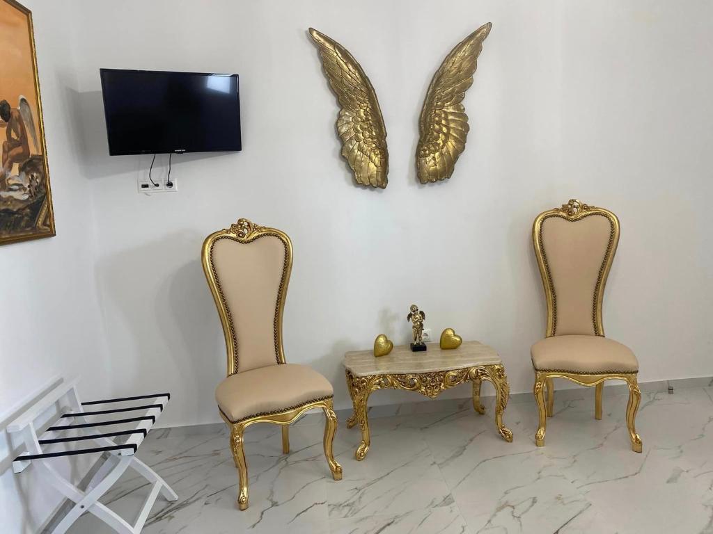 Televízia a/alebo spoločenská miestnosť v ubytovaní Mykonos Secret Spot