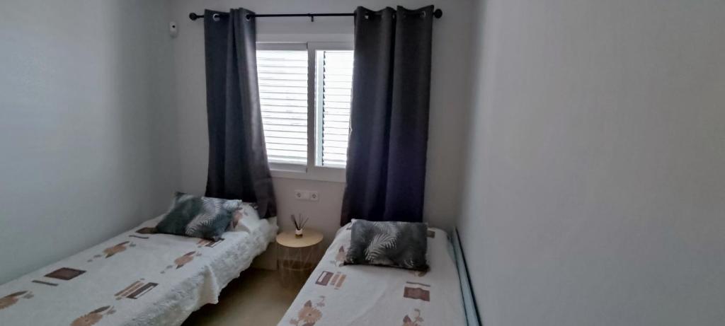 Postel nebo postele na pokoji v ubytování APARTAMENTO LES CALES