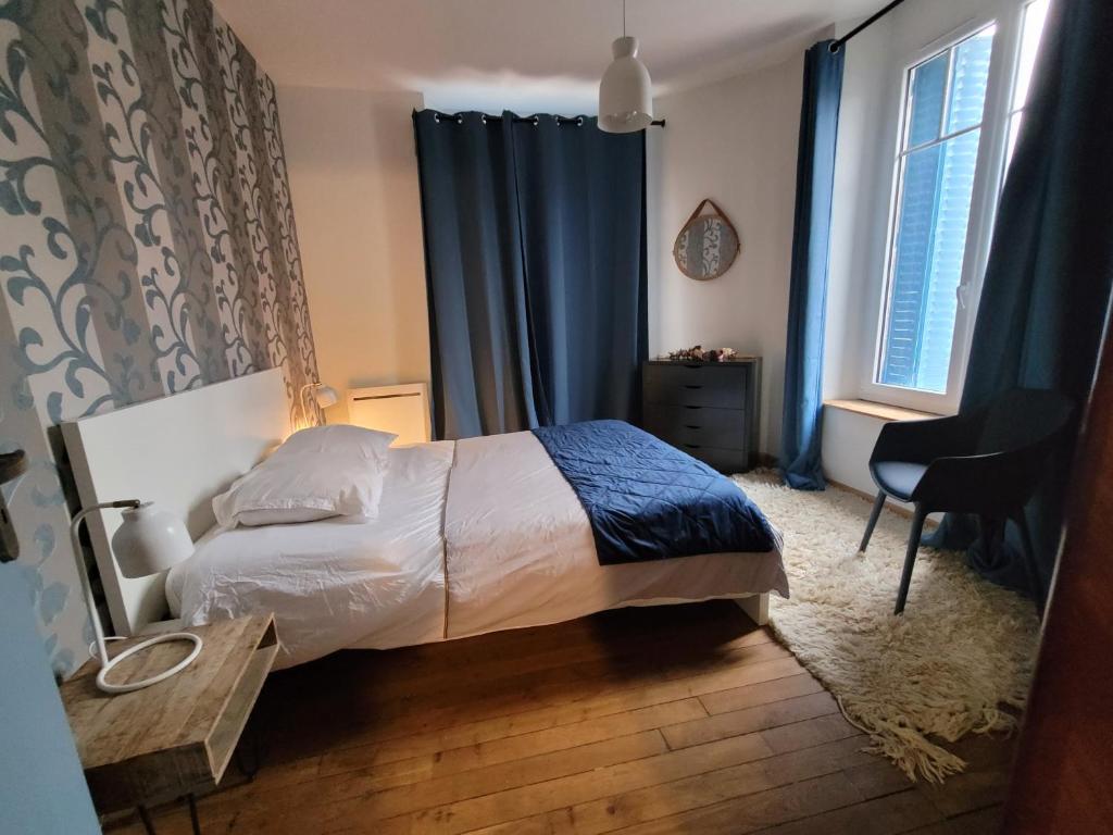 Postel nebo postele na pokoji v ubytování Appartements CDG JOIGNY