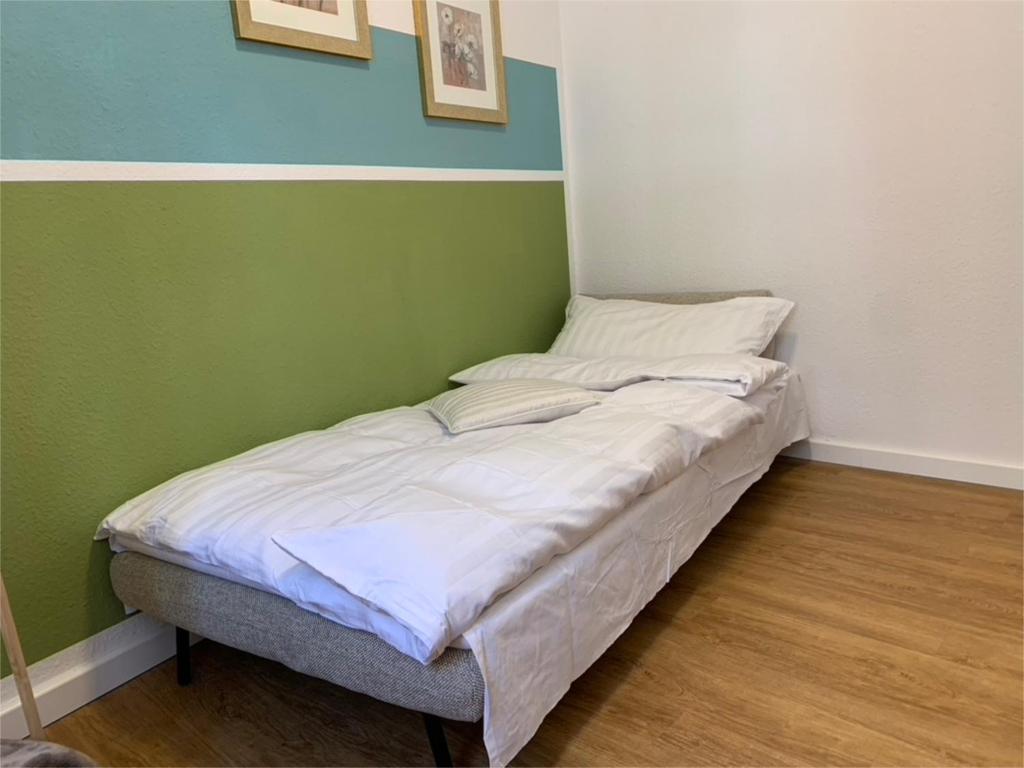 Postel nebo postele na pokoji v ubytování Ferienwohnung am Südwall All INCLUSIVE