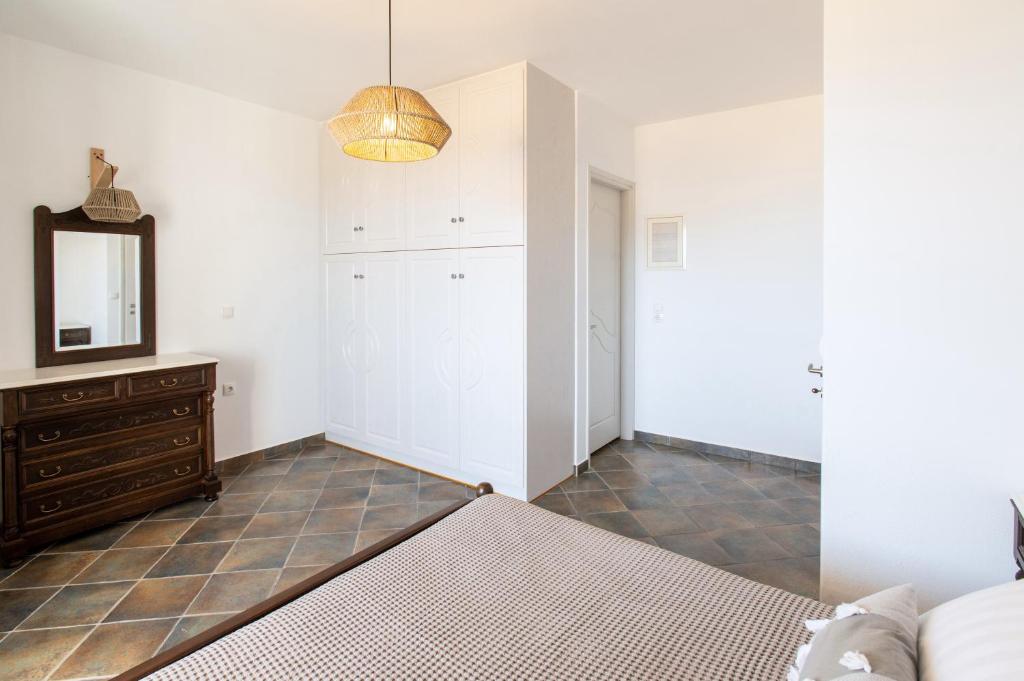 Postel nebo postele na pokoji v ubytování Sea Lilies Suites