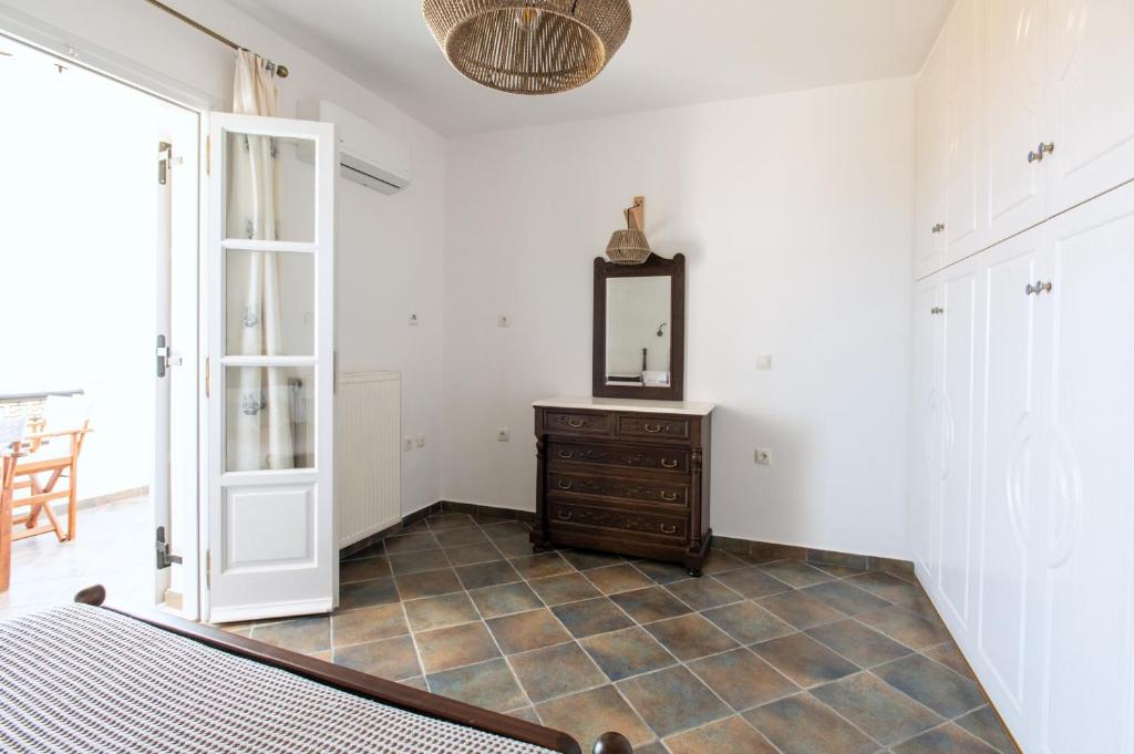 Postel nebo postele na pokoji v ubytování Sea Lilies Suites