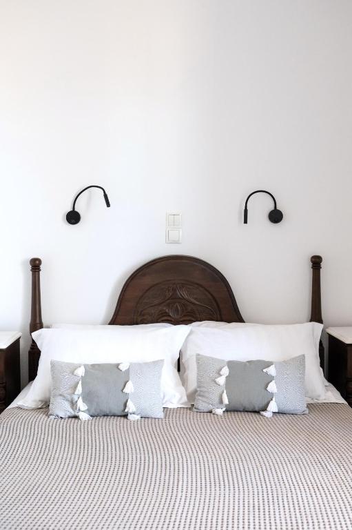 Postel nebo postele na pokoji v ubytování Sea Lilies Suites