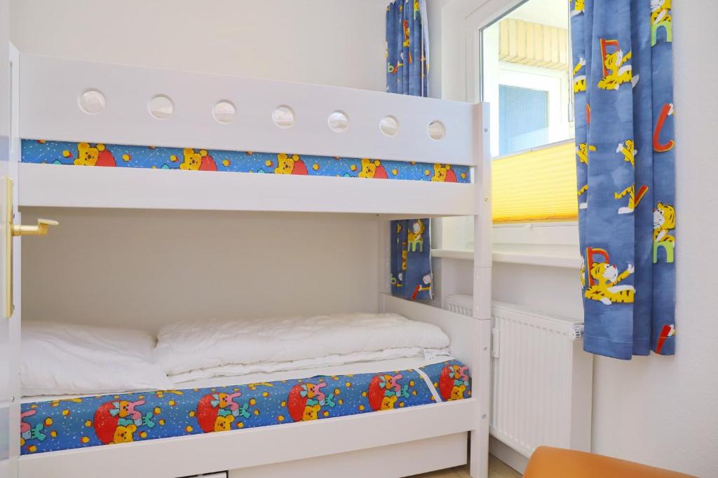 Postel nebo postele na pokoji v ubytování Strandschloss App 39