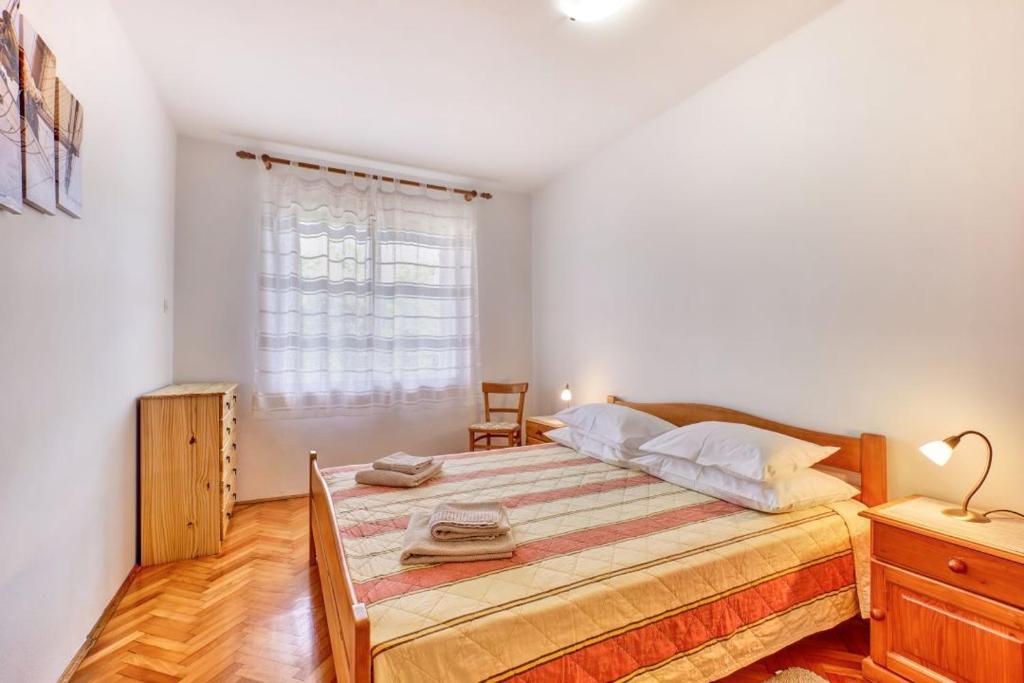 Voodi või voodid majutusasutuse Apartman Sučić toas
