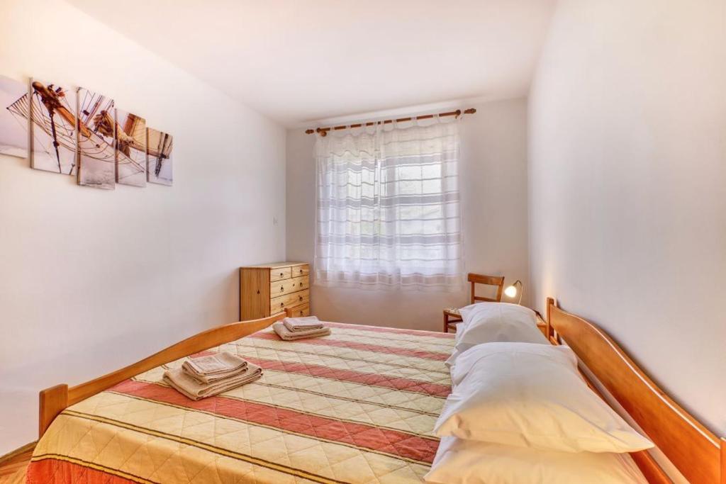 Voodi või voodid majutusasutuse Apartman Sučić toas
