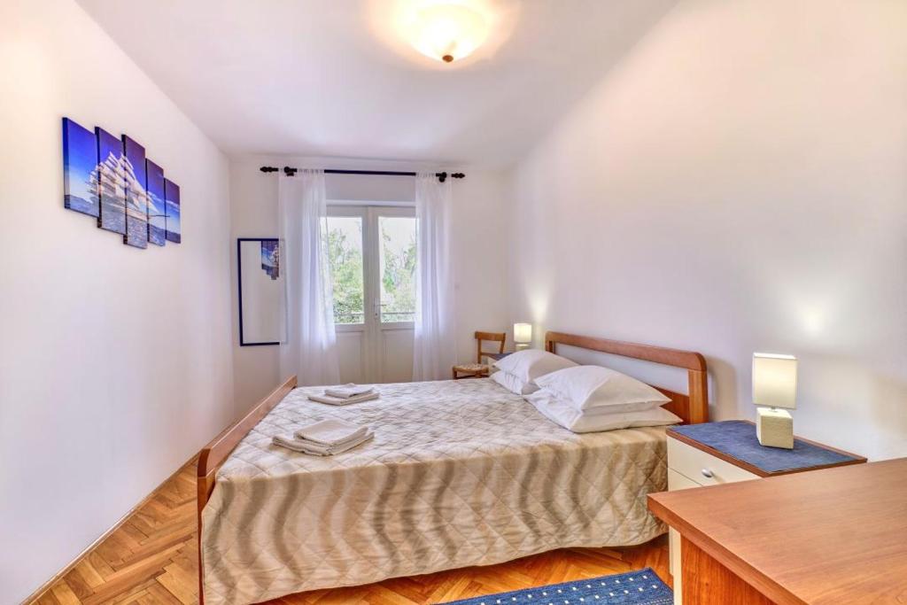 Voodi või voodid majutusasutuse Apartman Sučić toas
