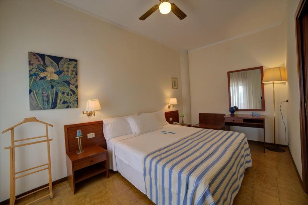 Postel nebo postele na pokoji v ubytování Hotel Sporting