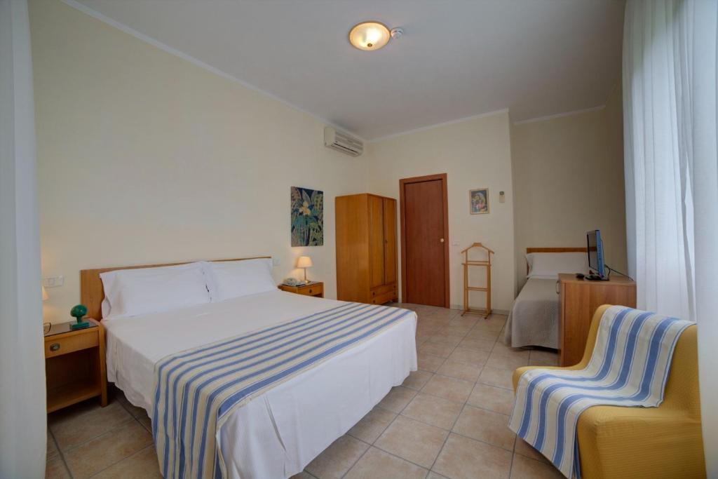 Postel nebo postele na pokoji v ubytování Hotel Sporting
