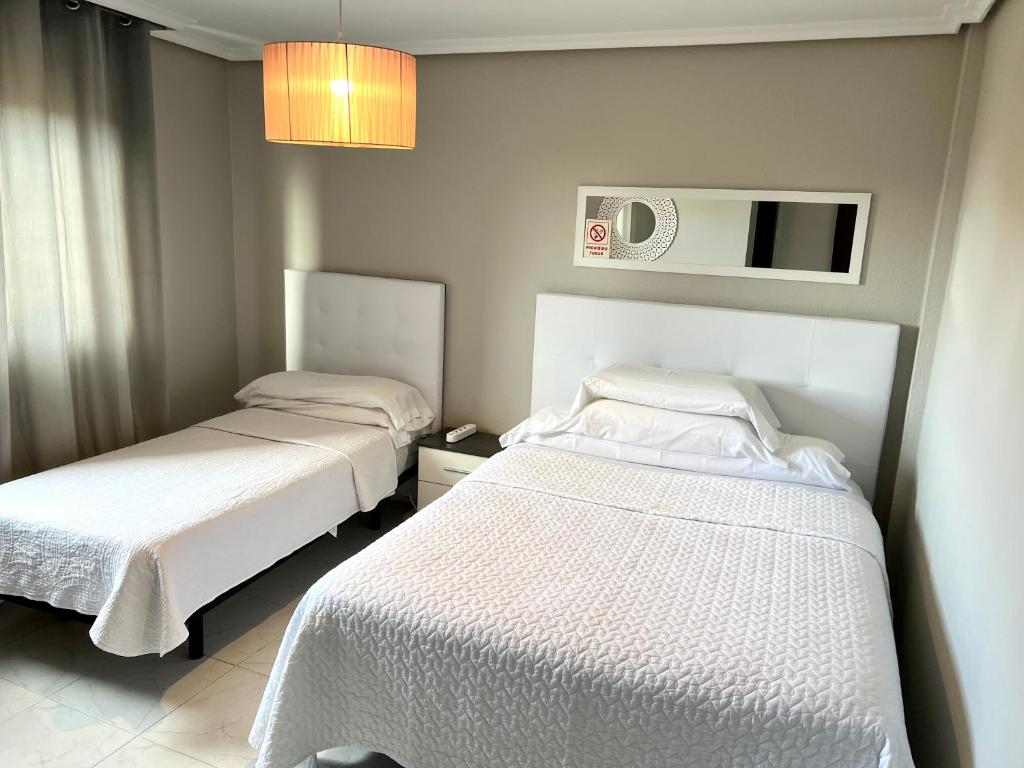 Postel nebo postele na pokoji v ubytování Hostal la Picota