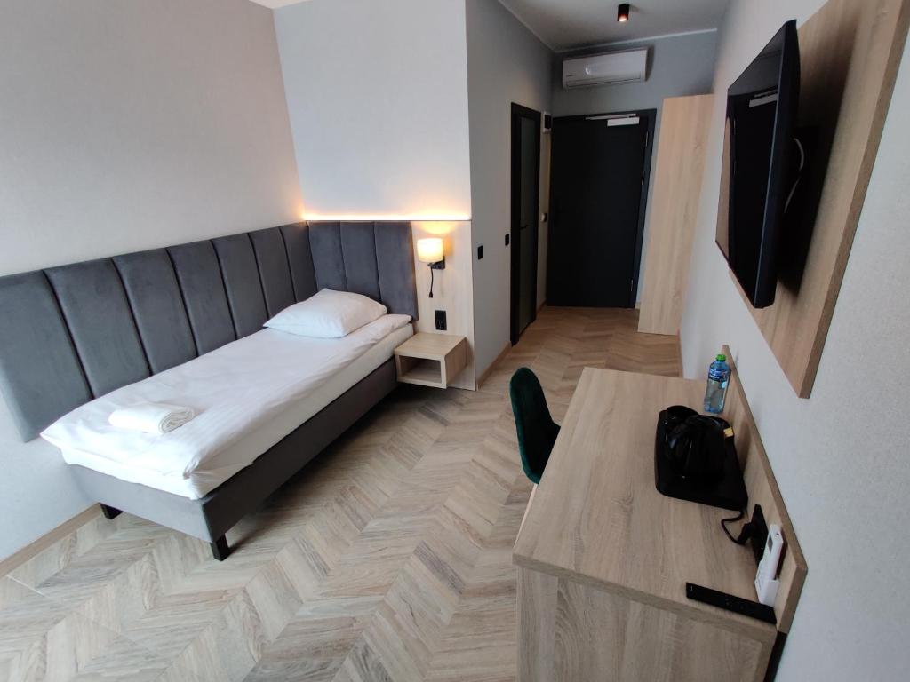 Postel nebo postele na pokoji v ubytování Nowe M4 Żyrardów Centrum - blisko Suntago