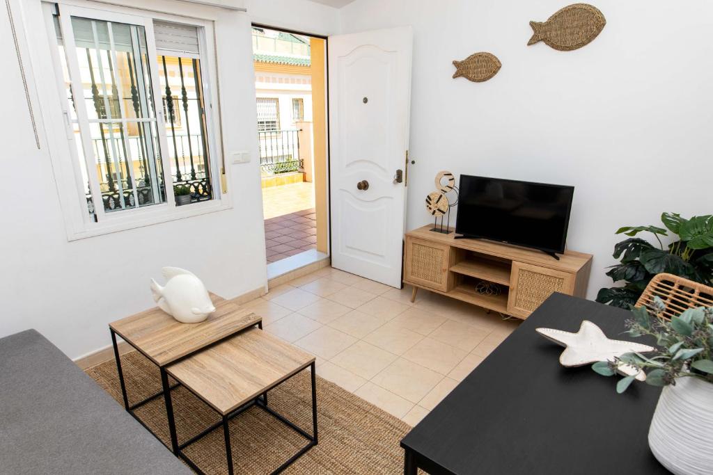 Televízia a/alebo spoločenská miestnosť v ubytovaní Apartamento Pedregalejo Playa