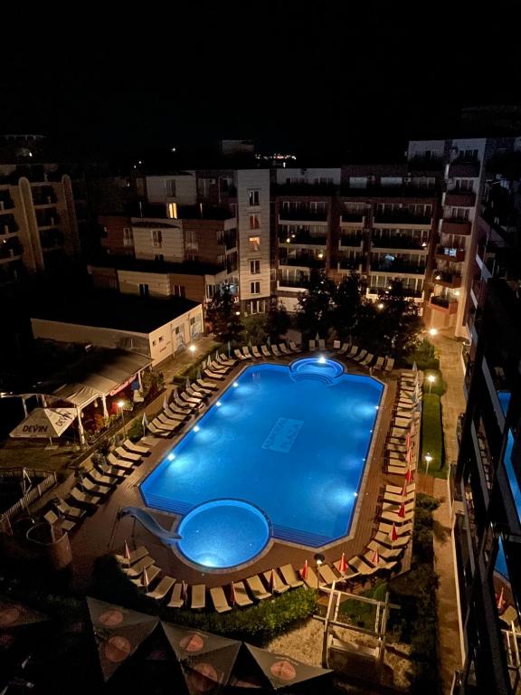 an overhead view of a swimming pool at night at Admiral Plaza in Sunny Beach