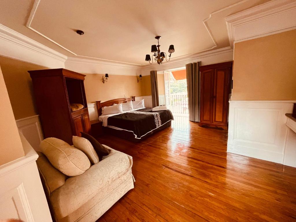 Postel nebo postele na pokoji v ubytování Hotel Real Del Monte