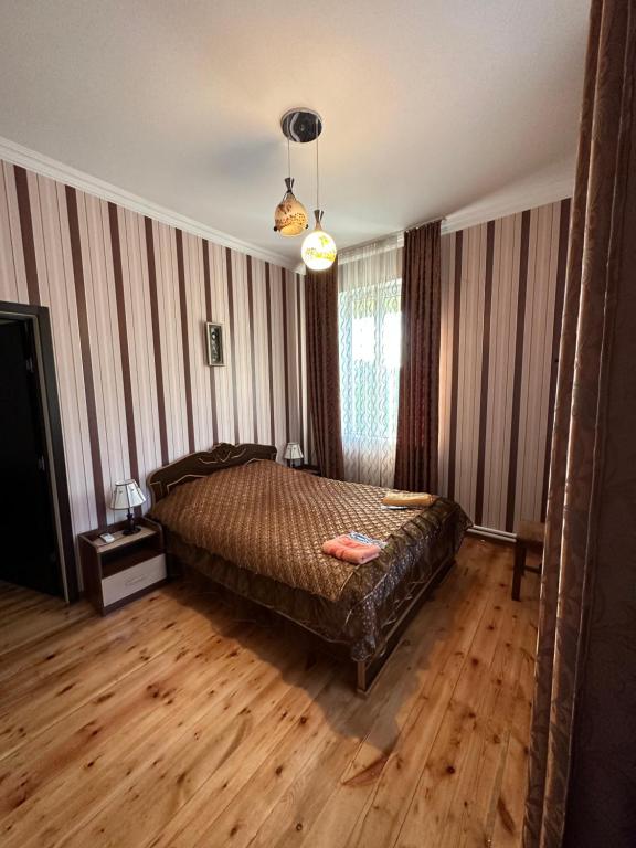 Postel nebo postele na pokoji v ubytování Mate Guesthouse