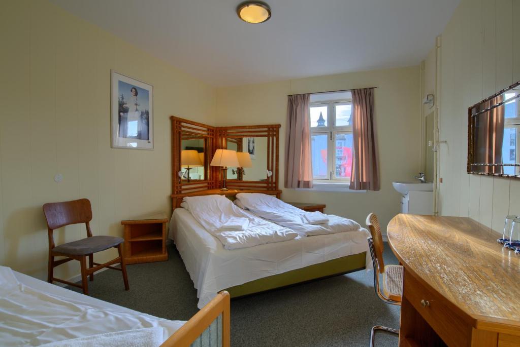Postel nebo postele na pokoji v ubytování Ebsens Hotel