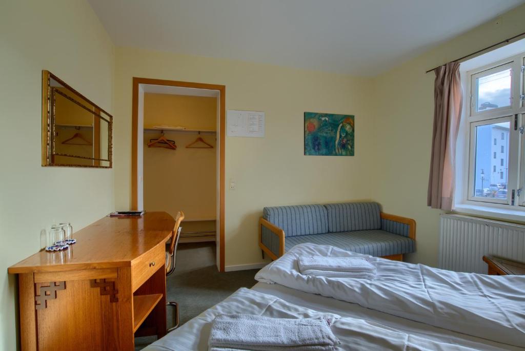 Postel nebo postele na pokoji v ubytování Ebsens Hotel