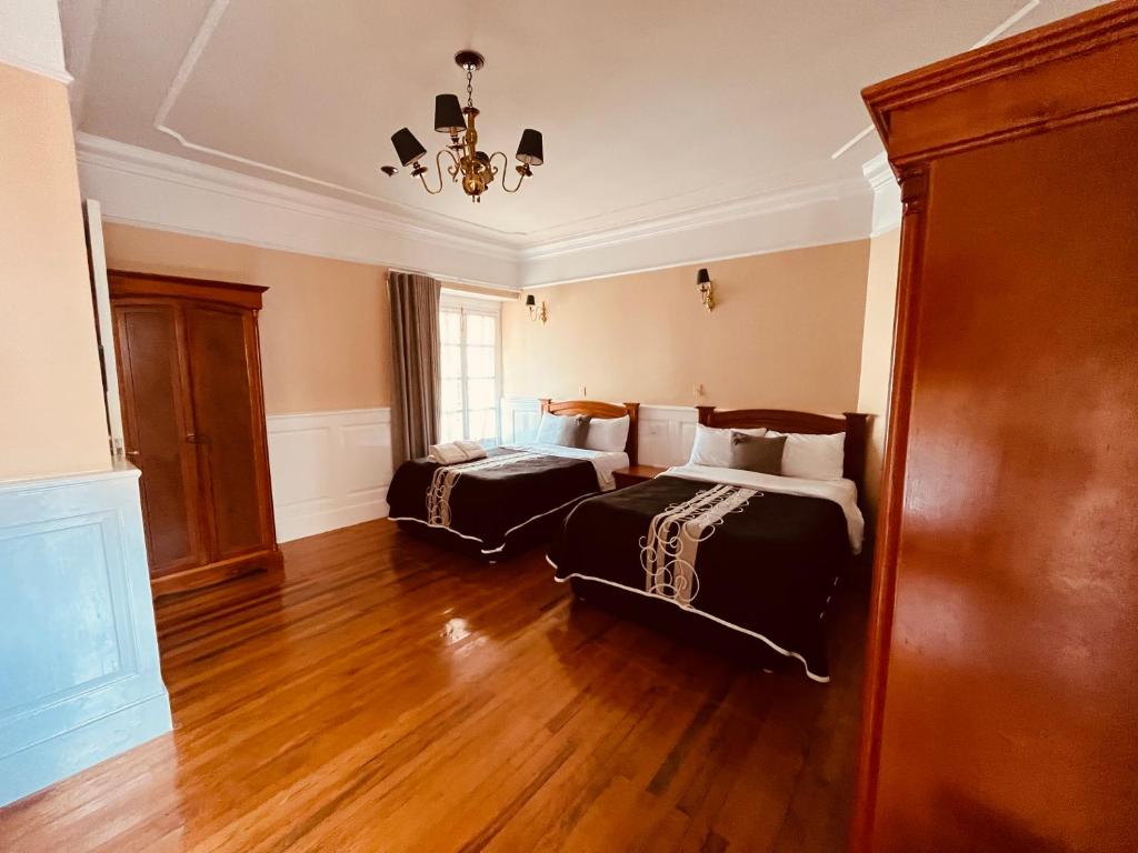 Postel nebo postele na pokoji v ubytování Hotel Real Del Monte