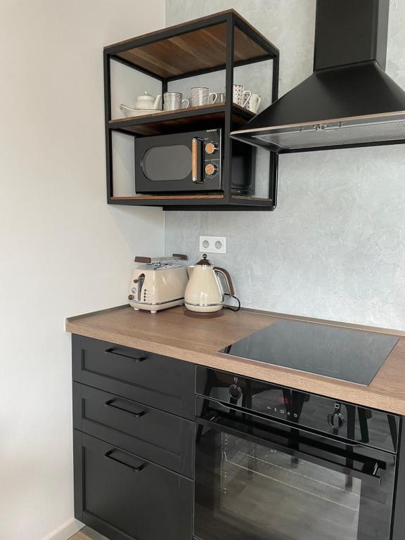 Kuchyň nebo kuchyňský kout v ubytování Apartmán Bella