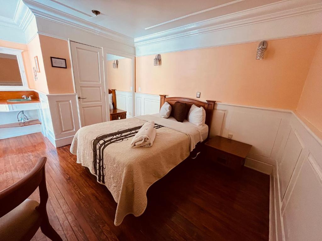 Postel nebo postele na pokoji v ubytování Hotel Real Del Monte