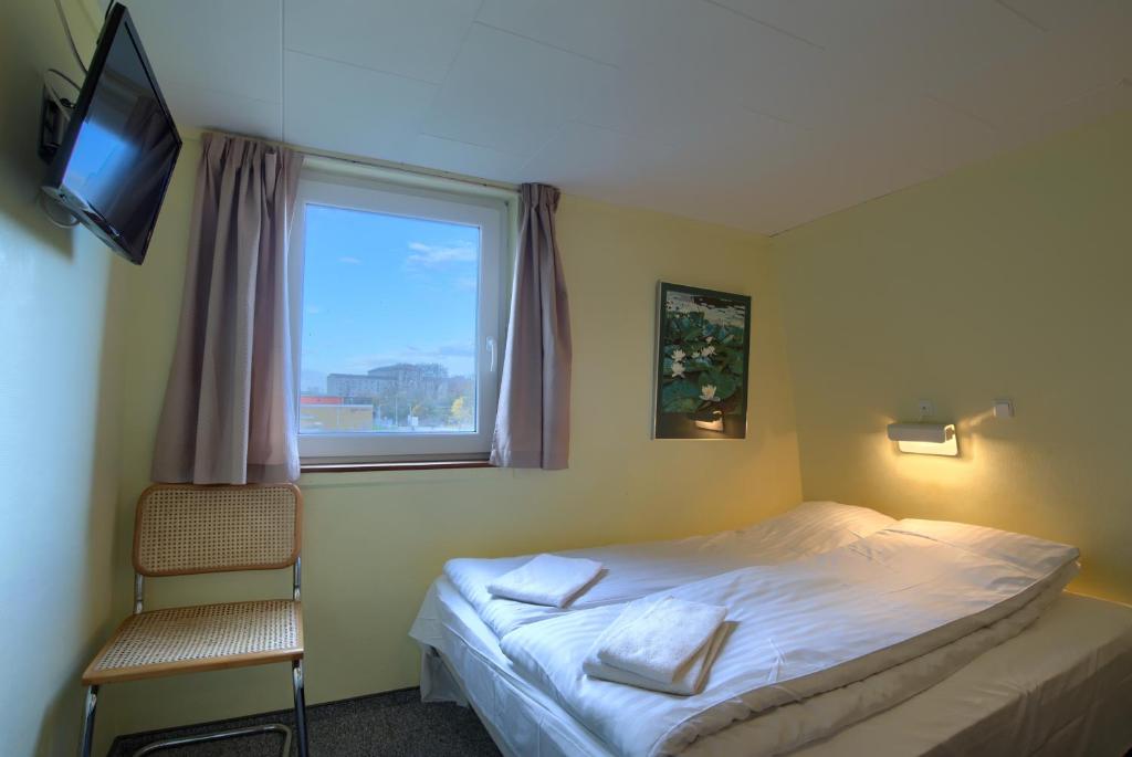 Postel nebo postele na pokoji v ubytování Ebsens Hotel