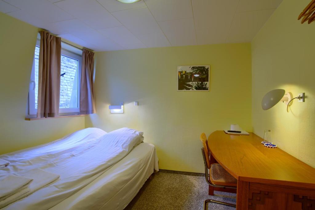 Postel nebo postele na pokoji v ubytování Ebsens Hotel