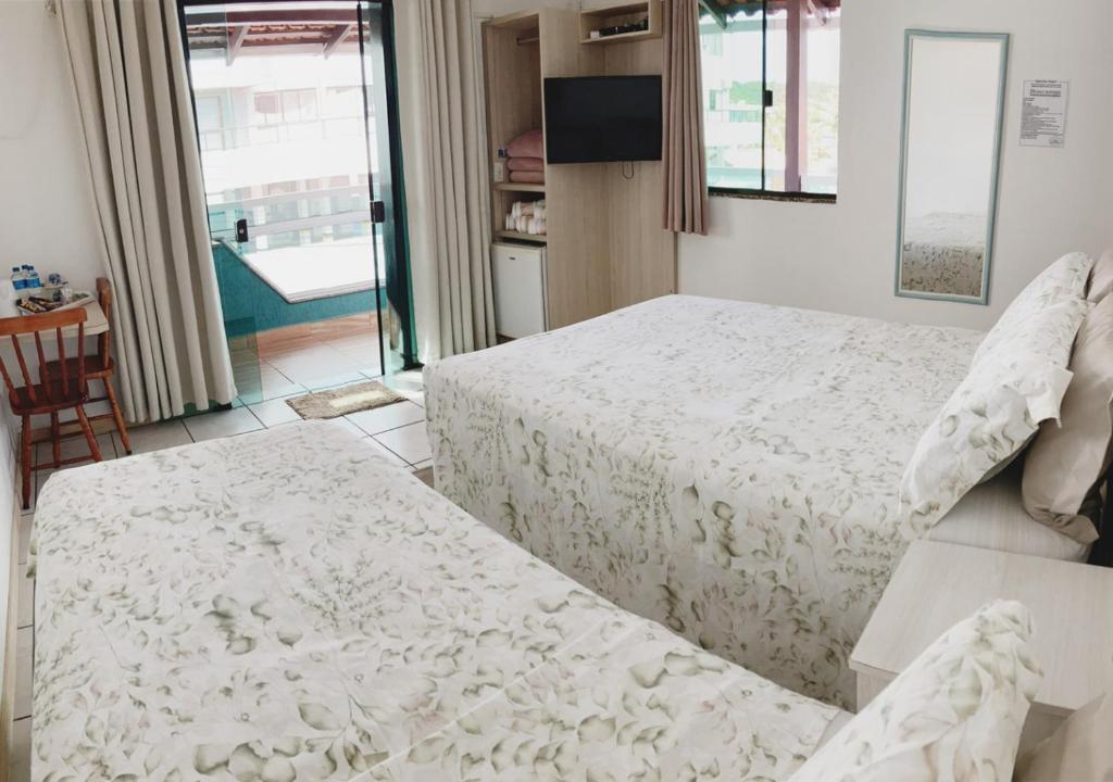 Cama ou camas em um quarto em Pousada Enseada dos Golfinhos