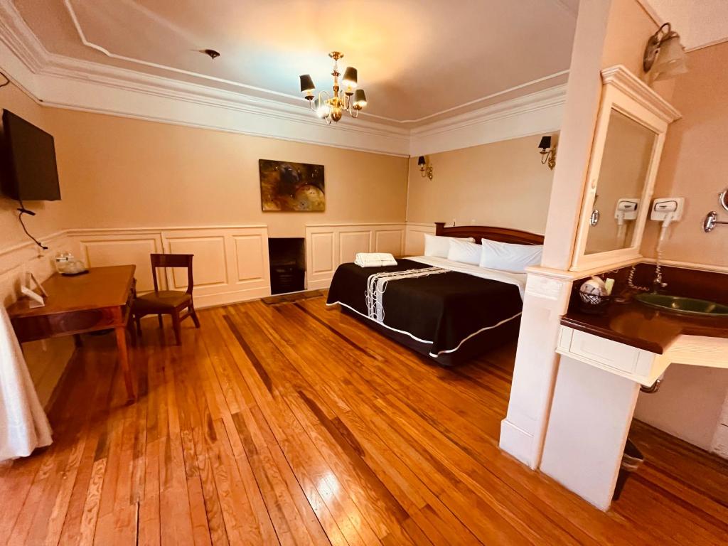 Postel nebo postele na pokoji v ubytování Hotel Real Del Monte