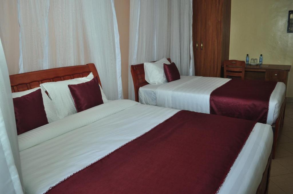 Postel nebo postele na pokoji v ubytování Decasa Hotel