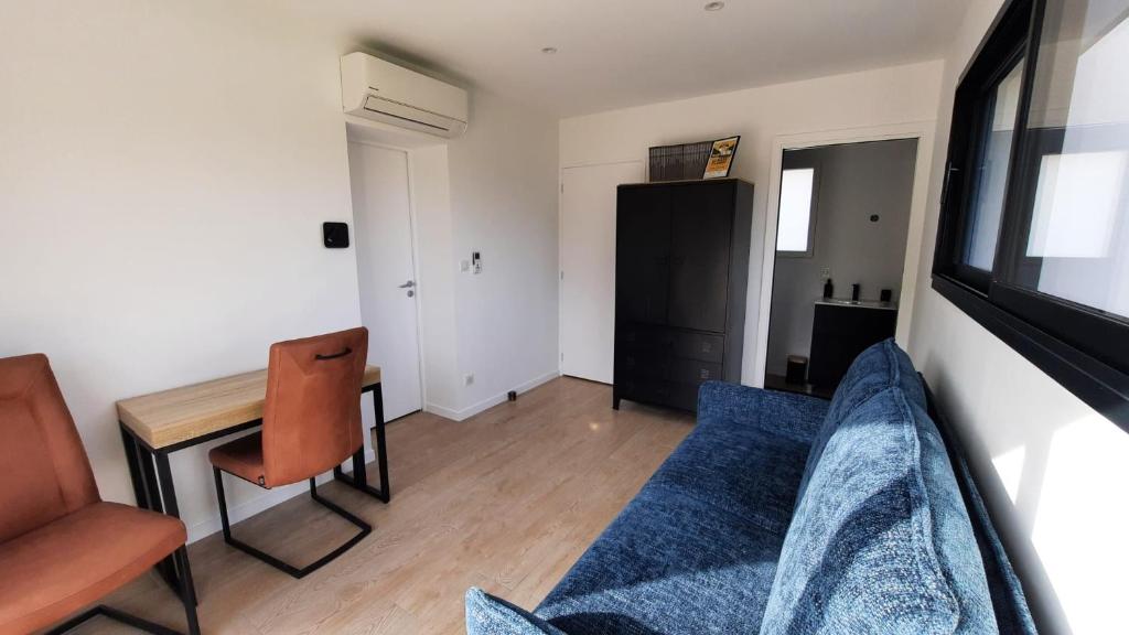 Χώρος καθιστικού στο Chambre avec accès privé