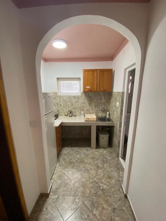 Kuchyň nebo kuchyňský kout v ubytování Apartmani Resetar