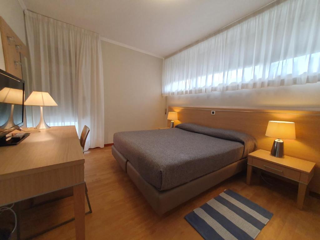 Postel nebo postele na pokoji v ubytování Hotel Eurovil Garni