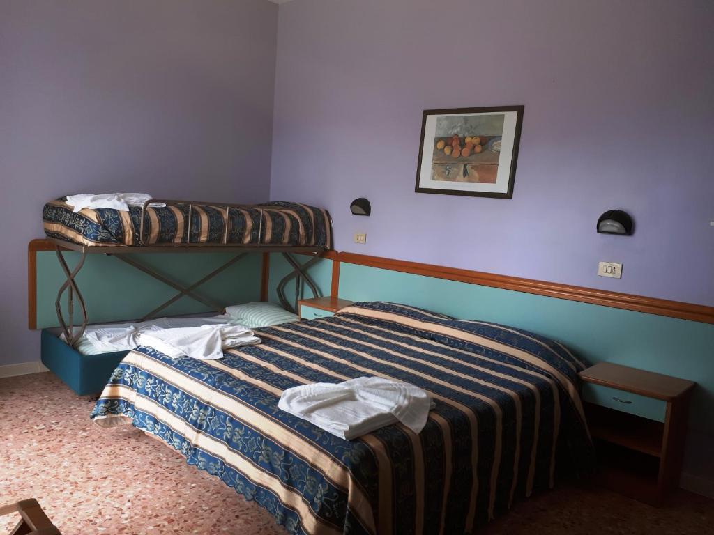 Postel nebo postele na pokoji v ubytování Hotel Bahamas